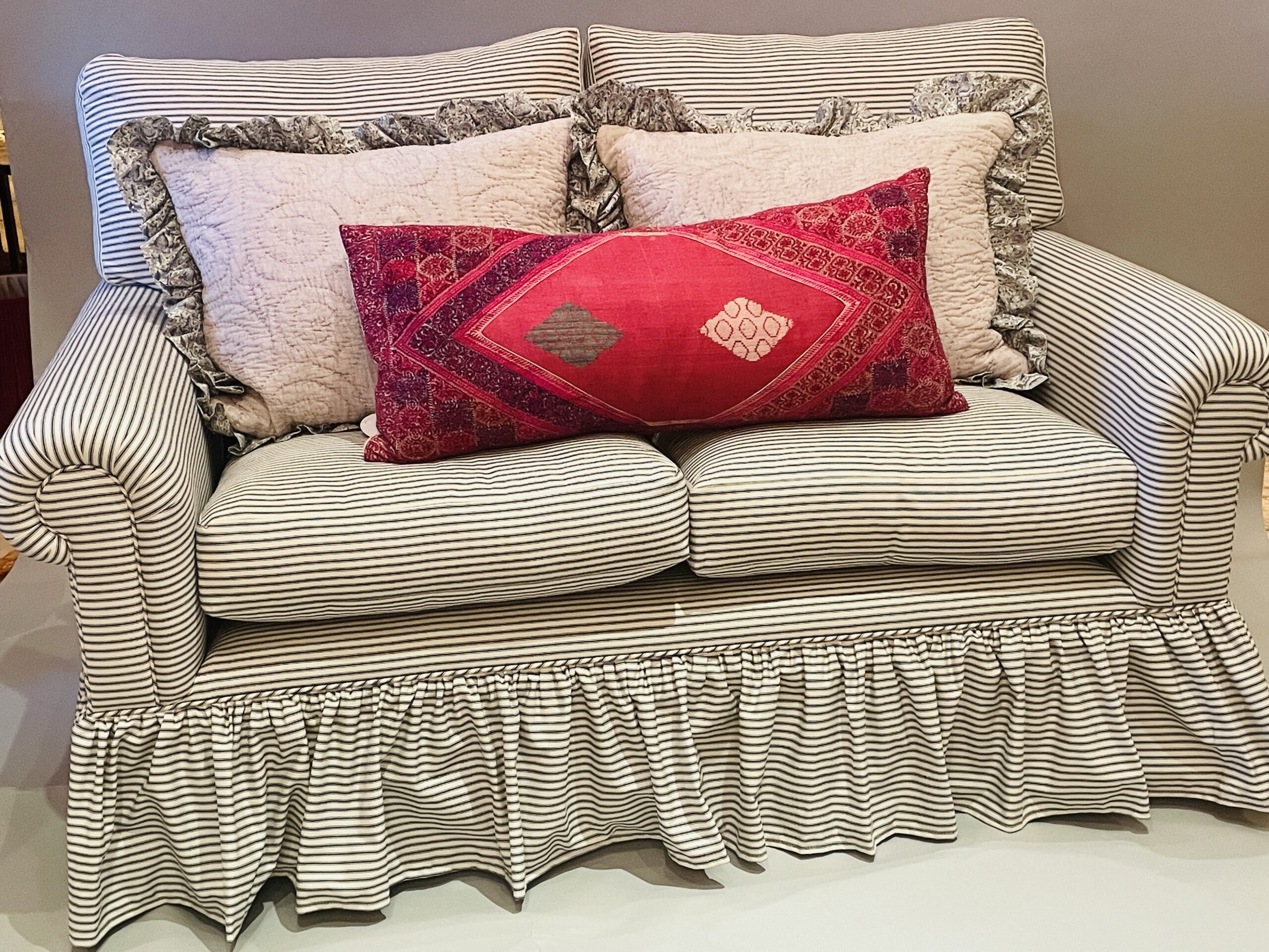 Red and deals white striped sofa